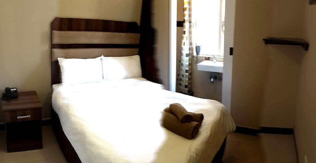 Hotel Cube Durban Quarto foto